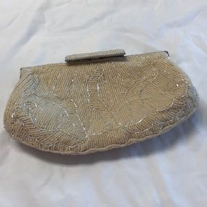 Nina cream colored all beaded clutch.